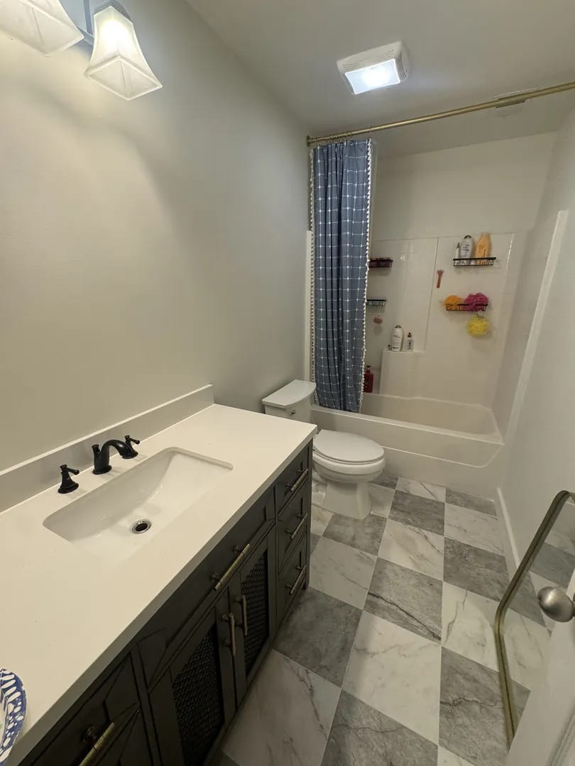 Bathroom after renovation - Buttonwood, Spring Hill - new vanity and marble tile floor